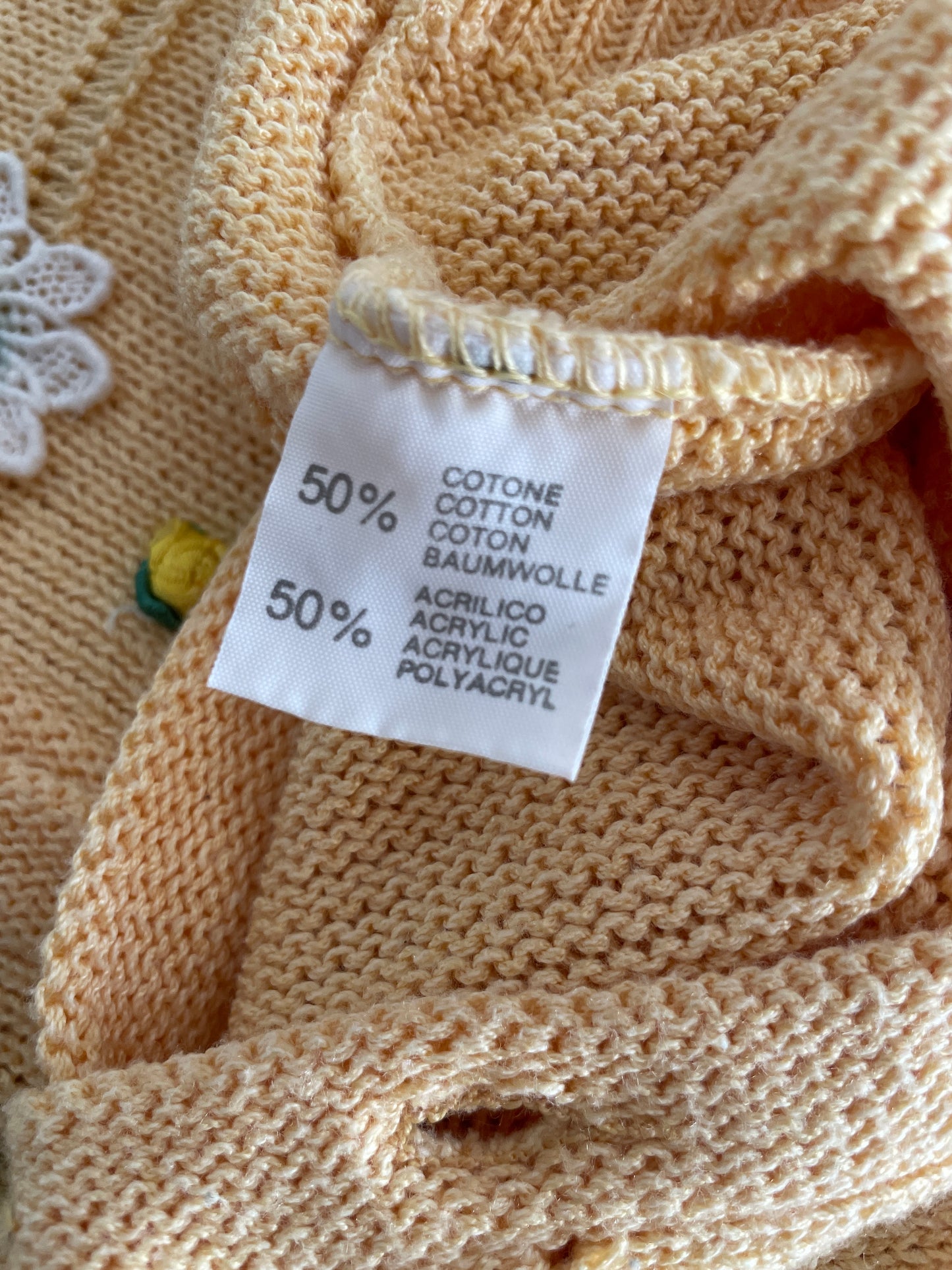 Yellow knitted vintage cardigan with daisies