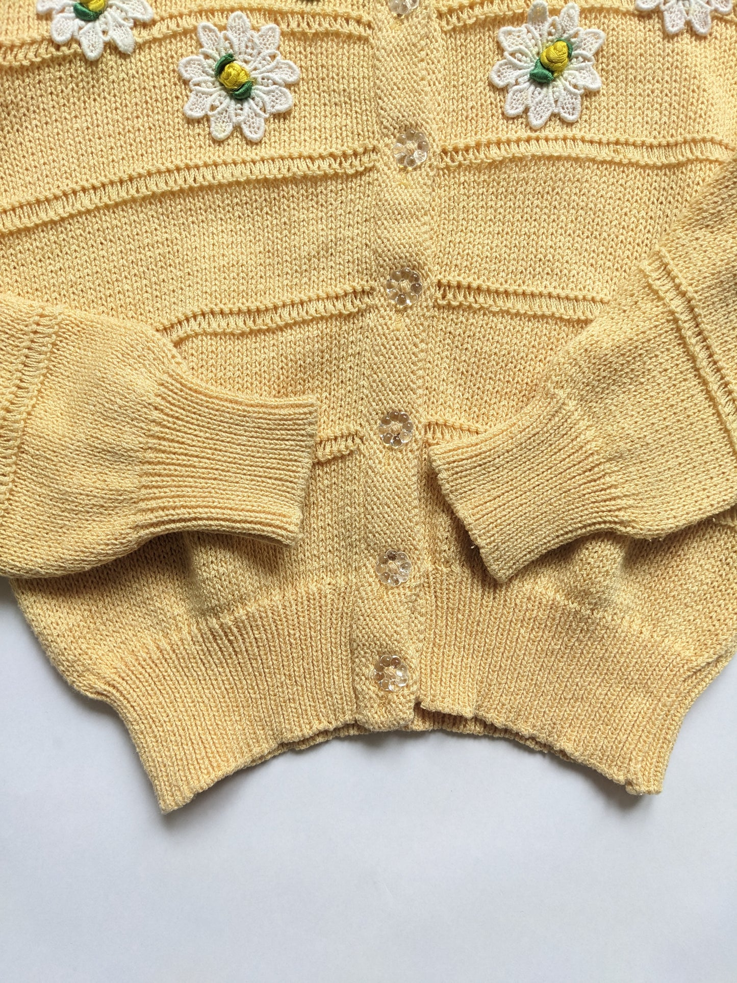 Yellow knitted vintage cardigan with daisies