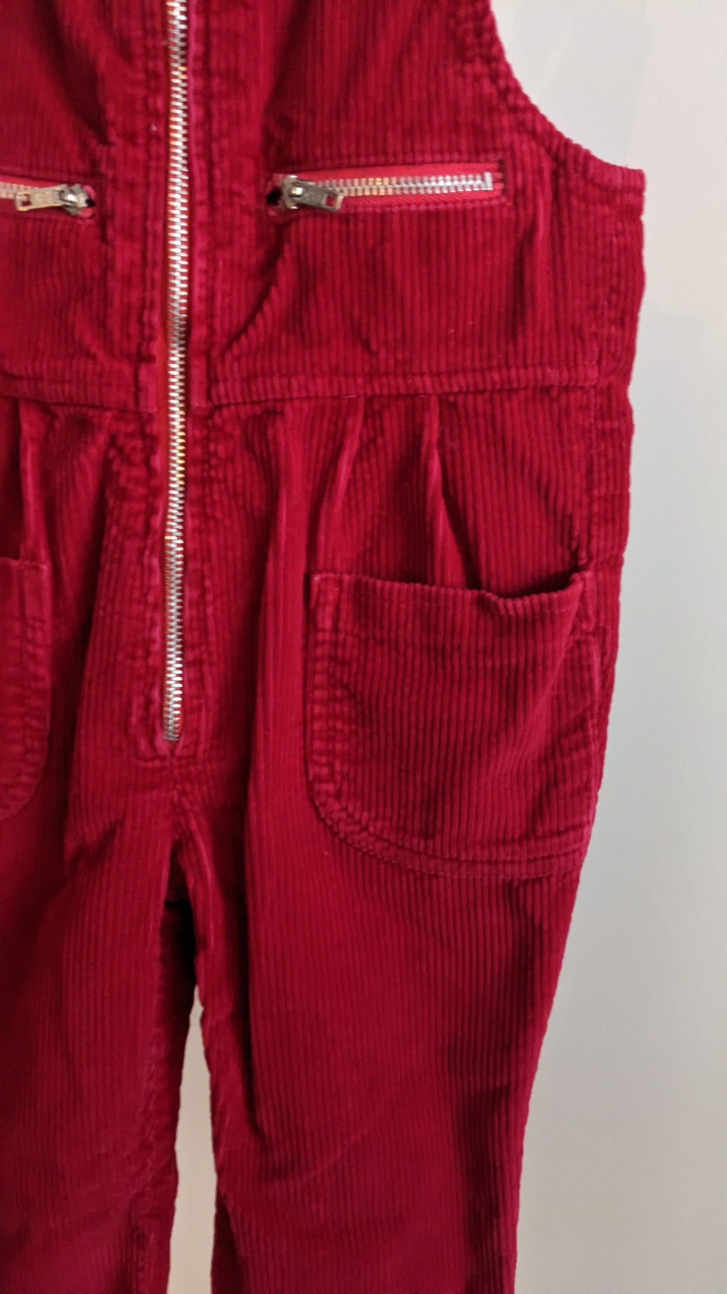 Red corduroy overall with zipped details