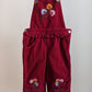 Red corduroy overall with frill and flowers