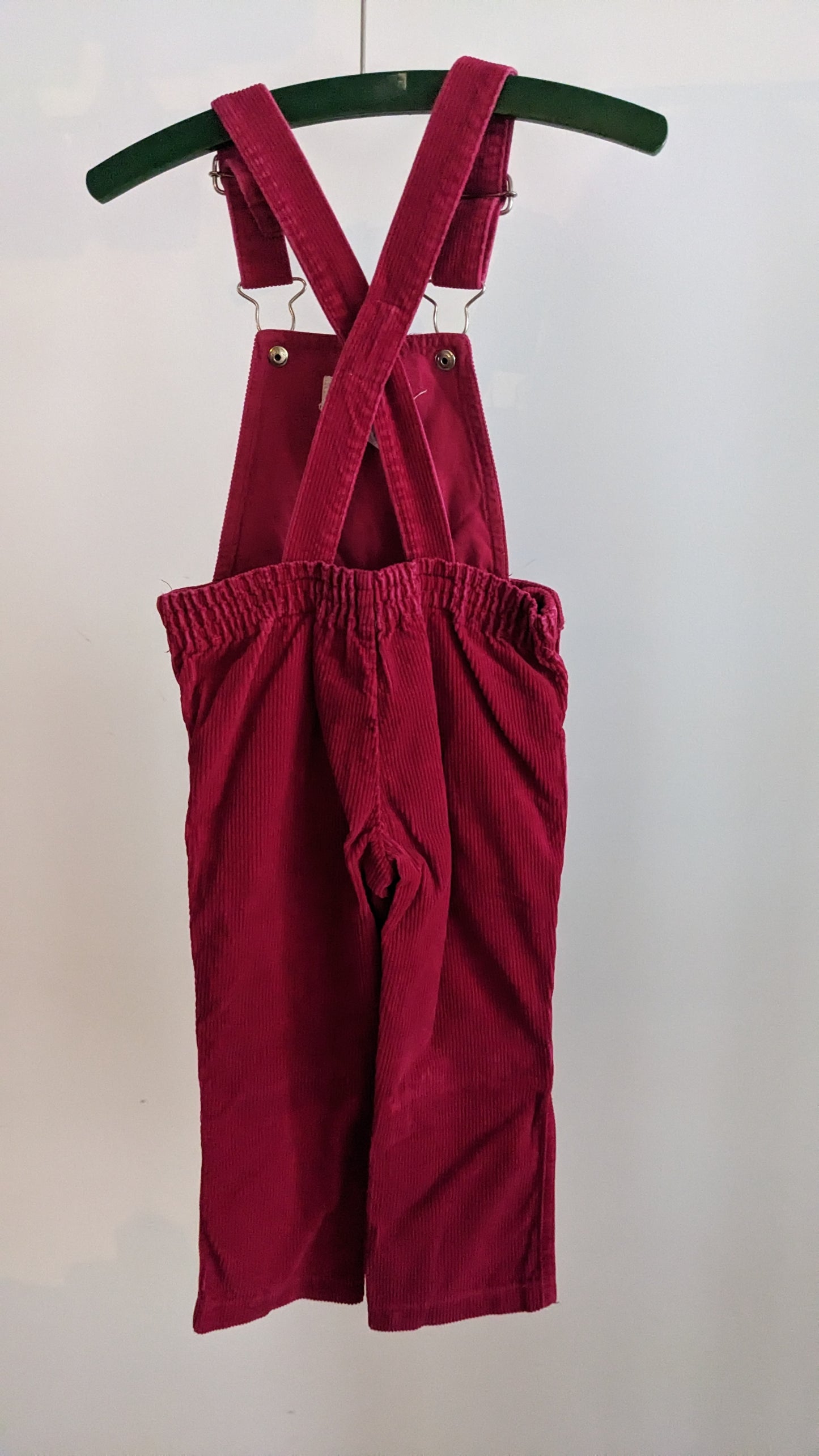 Red corduroy overall with frill and flowers