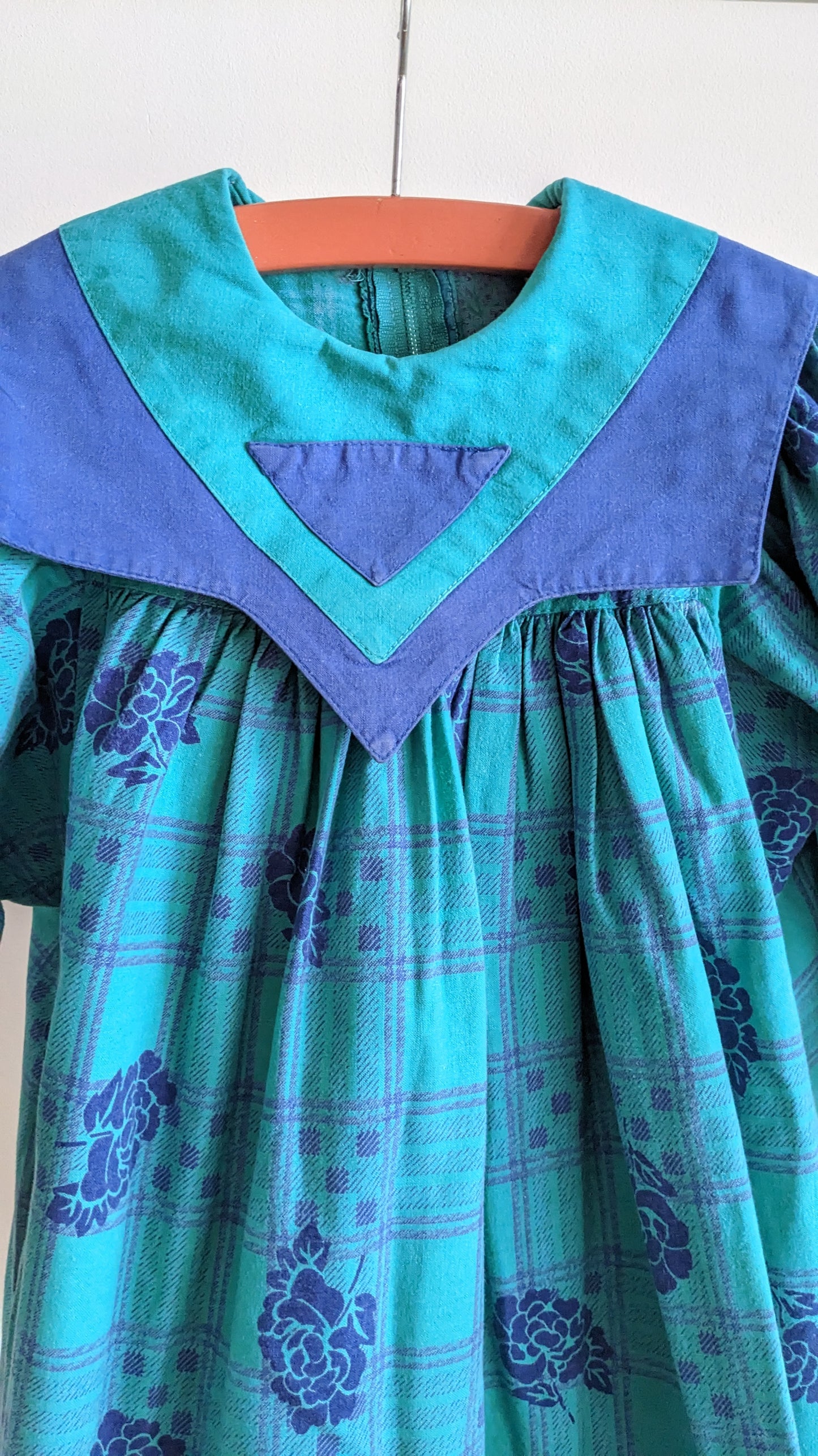 Green and blue dress with a big collar