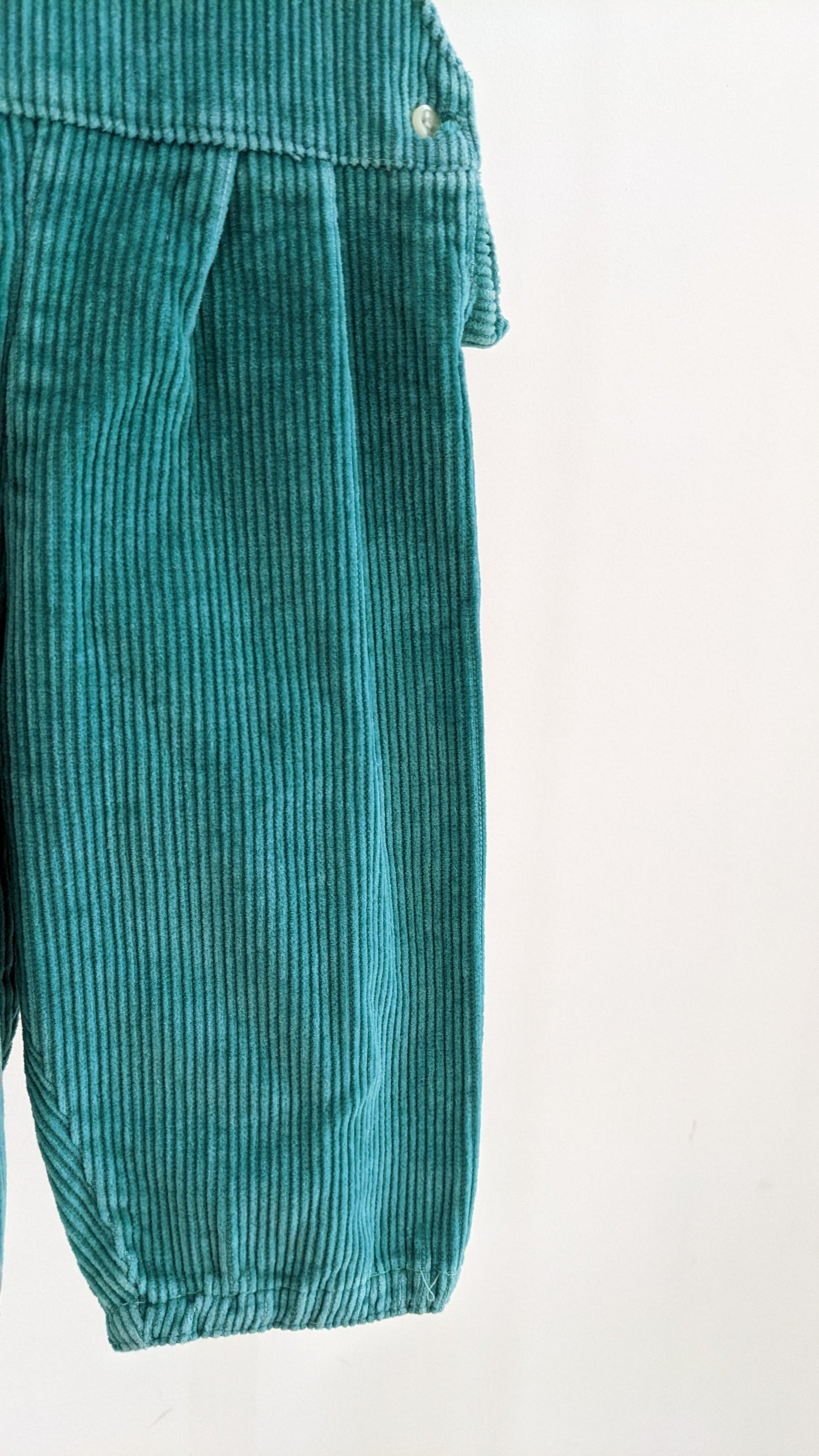 Green corduroy overall with pencil